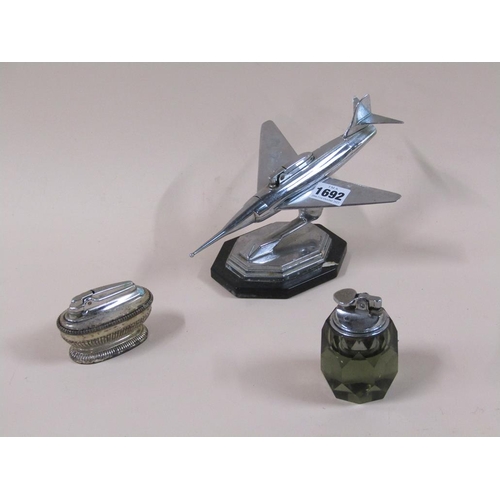 1692 - CHROME TABLE LIGHTER IN THE FORM OF A FIGHTER JET AND TWO OTHER TABLE LIGHTERS