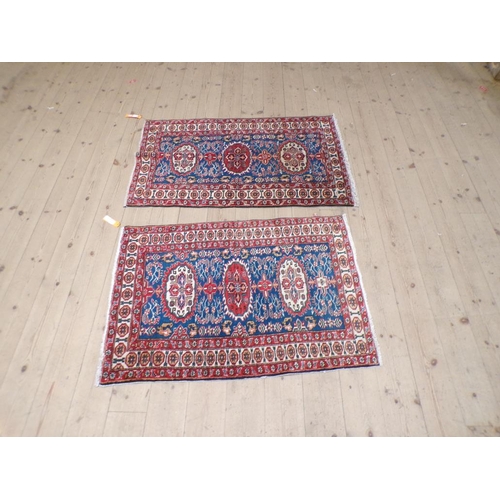 1968 - PAIR OF ORIENTAL RED BLUE AND FAWN GROUND PATTERNED RUGS EACH 71cm x 106cm & 70cm x 116.5cm