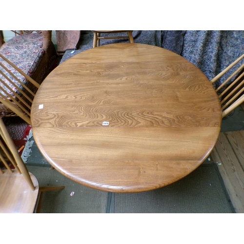 1978 - ERCOL TWIN FLAP DINING TABLE TOGETHER WITH FOUR STICK BACK CHAIRS