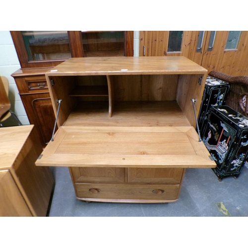 1979 - ERCOL SECRETAIRE CABINET WITH FALL FRONT OVER CUPBOARD AND ONE LONG BASE DRAWER 82 x 110cms