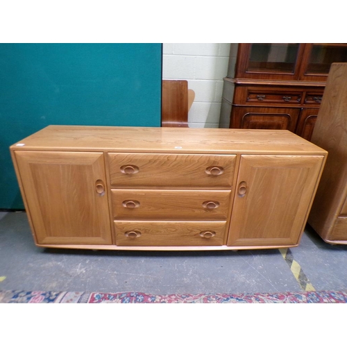 1980 - ERCOL TEAK SIDEBOARD OF THREE CENTRAL DRAWERS FLANKED BY TWO CUPBOARDS ENCLOSED BY SINGLE DOORS 156 ... 