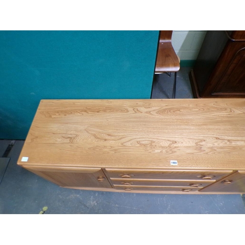 1980 - ERCOL TEAK SIDEBOARD OF THREE CENTRAL DRAWERS FLANKED BY TWO CUPBOARDS ENCLOSED BY SINGLE DOORS 156 ... 