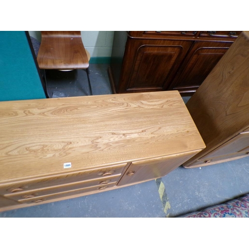 1980 - ERCOL TEAK SIDEBOARD OF THREE CENTRAL DRAWERS FLANKED BY TWO CUPBOARDS ENCLOSED BY SINGLE DOORS 156 ... 