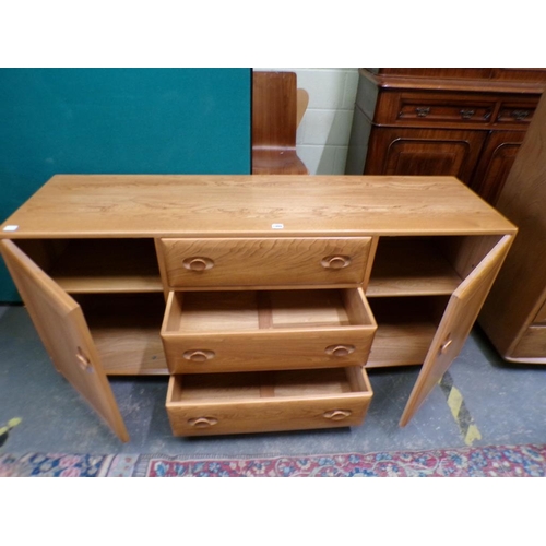 1980 - ERCOL TEAK SIDEBOARD OF THREE CENTRAL DRAWERS FLANKED BY TWO CUPBOARDS ENCLOSED BY SINGLE DOORS 156 ... 