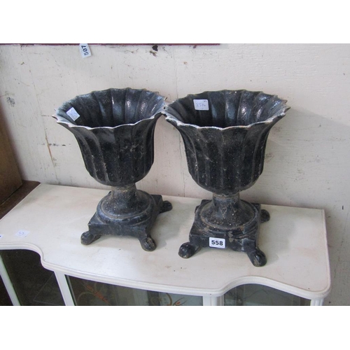 558 - TWO CAST IRON PLANTERS