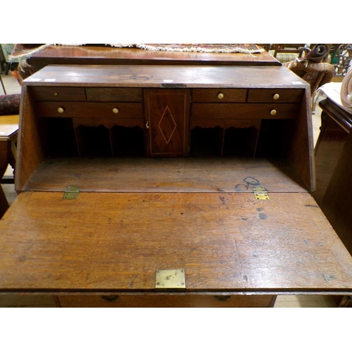 2099 - LATE GEORGIAN OAK BUREAU WITH FALL FRONT AND FITTED INTERIOR OVER FOUR LONG DRAWERS, 115CM H