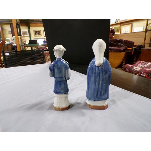 1943 - TWO ORIENTAL POTTERY FIGURES - LARGEST 18.5CM H