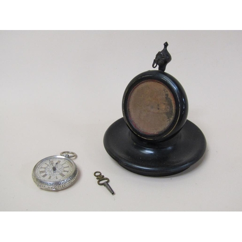 110 - A late Victorian ebonised watch stand together with a silver cased and silver faced fob watch, 11.5c... 