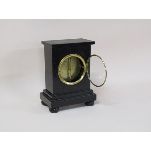 18 - A mid 19c English mantel clock in a rectangular black marble case, the central section hewn from a s... 