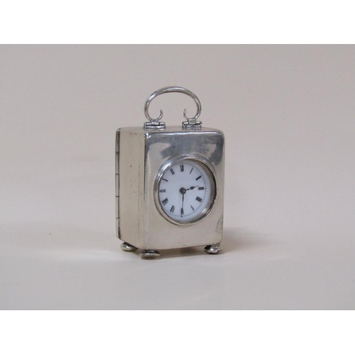 33 - A French miniature carriage clock, the silver 'boite' case hallmarked for 1920.  The single train mo... 