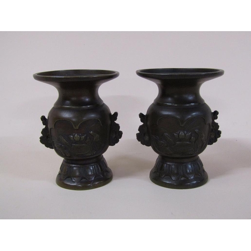 57 - A pair of 19c Oriental bronze baluster vases, the bodies decorated with lakeside scenes and having w... 