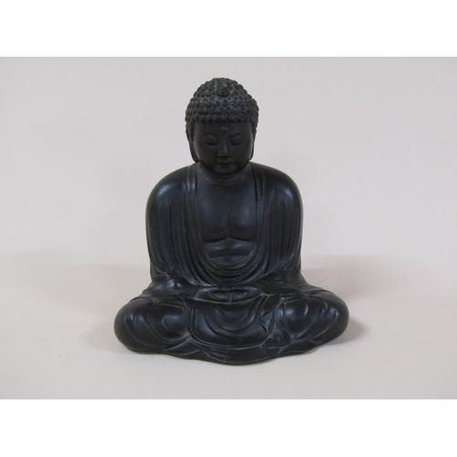 58 - A 19c Oriental bronze buddha, base inscribed, 13cm h.