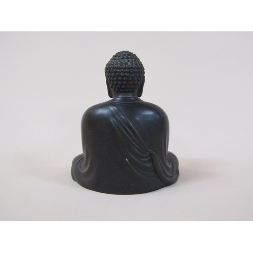 58 - A 19c Oriental bronze buddha, base inscribed, 13cm h.