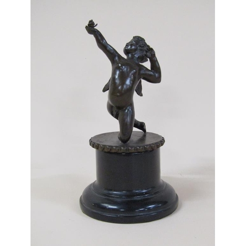 61 - A Tom Merrifield bronze figure of a cherub on circular beaded base and marble stand, the figure 12cm... 