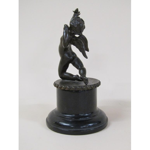 61 - A Tom Merrifield bronze figure of a cherub on circular beaded base and marble stand, the figure 12cm... 