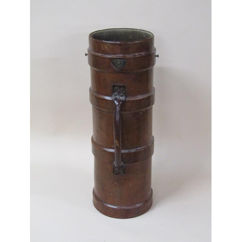 68 - A 19c brown leather canvas two handled powder/shot carrier of cylindrical form, 73cm h.