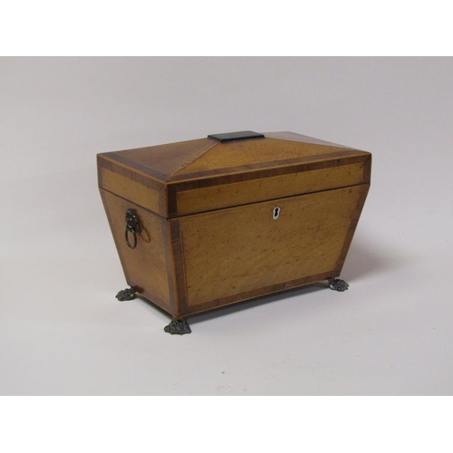 75 - A late Georgian satinwood two compartment tea caddy with mixing bowl and recess, being of sarcophagu... 