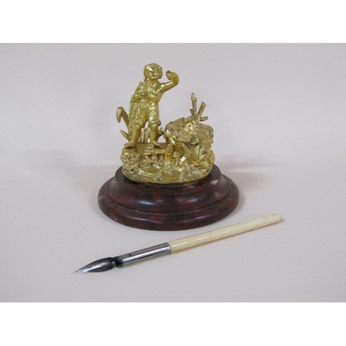 77 - A Victorian gilt bronze inkwell with the figure of a fisherman, the well with lift up cover and with... 