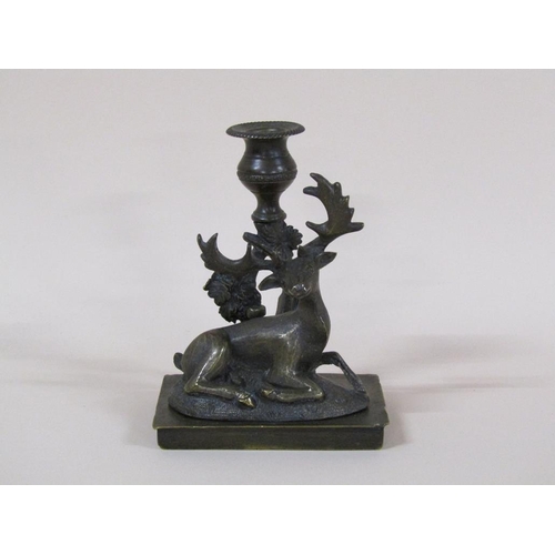 81 - A Regency bronze candlestick group with a recumbent deer, 8cm h, 11cm w.