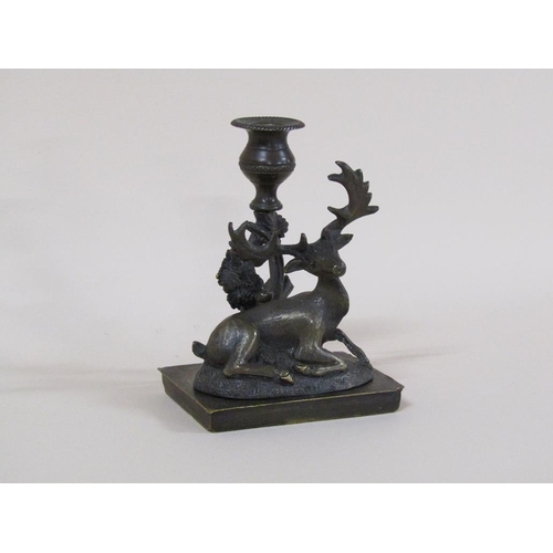 81 - A Regency bronze candlestick group with a recumbent deer, 8cm h, 11cm w.