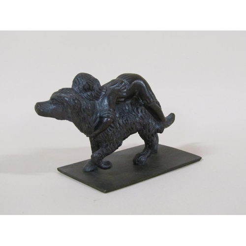 85 - A Victorian bronze figure group of a girl having a ride on a large dog, 7cm w.