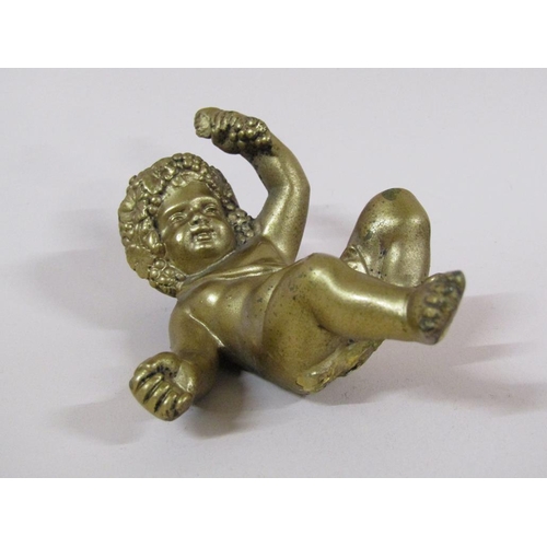 87 - A late Georgian gilt bronze figure of a cherub, 9cm h.