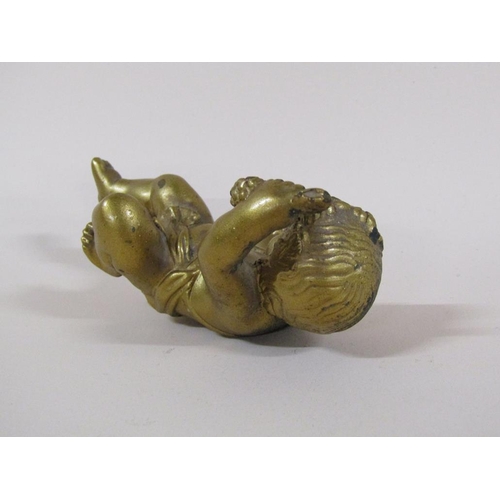 87 - A late Georgian gilt bronze figure of a cherub, 9cm h.