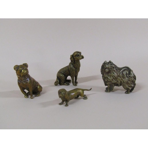 90 - An early 20c collection of four miniature dogs, three bronze and one nickel, 5cm to 6cm w.