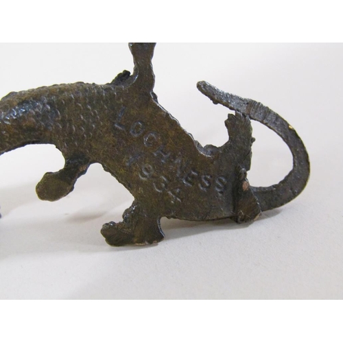 91 - An early 20c patinated bronze miniature figure of Loch Ness monster, the base inscribed Loch Ness, 5... 