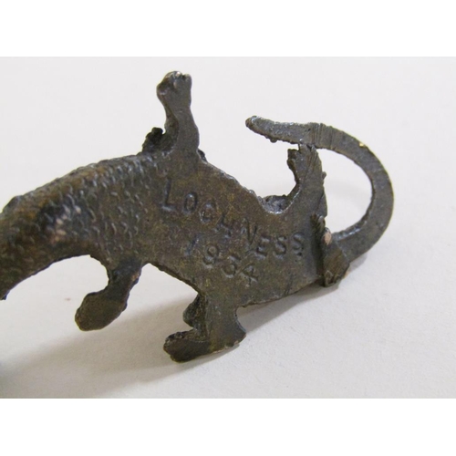 91 - An early 20c patinated bronze miniature figure of Loch Ness monster, the base inscribed Loch Ness, 5... 