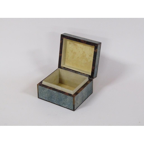 99 - An early 20c shagreen and tortoiseshell cigarette box with an agate stone mount, 12cm w, 6.5cm h.