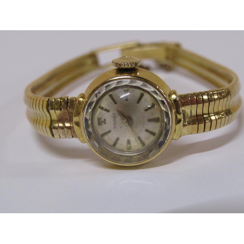 112 - An 18ct gold Tissot ladies watch with faceted glass dial and attached safety chain, 22.6g total weig... 