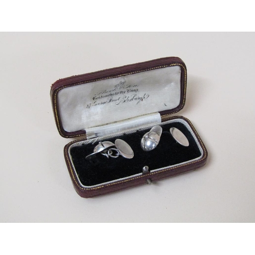 115 - A pair of sterling silver (stamped 925) jockey cap cufflinks.