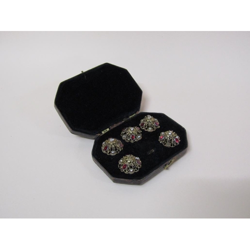 116 - A boxed set of five Austro Hungarian silver gilt buttons, each with baroque pearl and garnet.