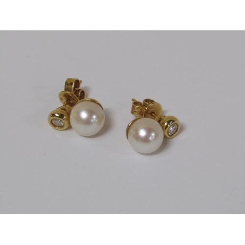 118 - A pair of 18ct gold diamond and pearl earrings.