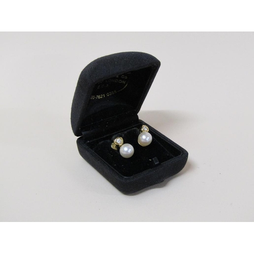 118 - A pair of 18ct gold diamond and pearl earrings.