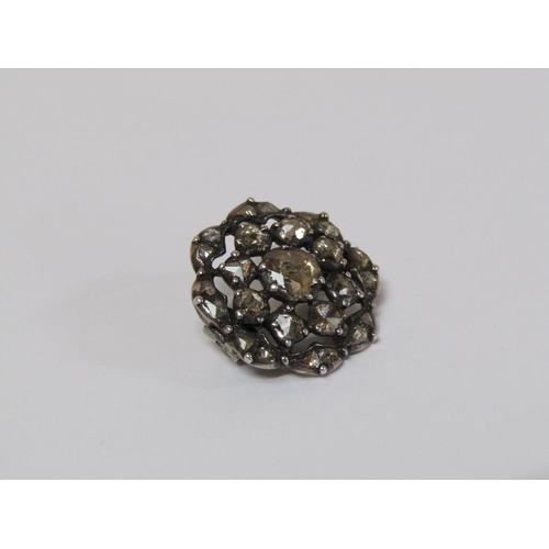 122 - A Victorian diamond brooch of floral form set with twenty five old cut graduated stones.