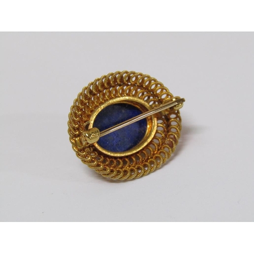 123 - A 14k gold lapis lazuli brooch of oval form, 4.8g total weight.