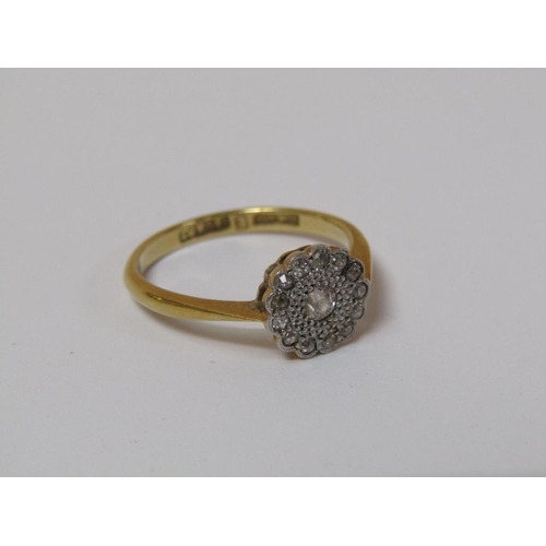 125 - An 18ct gold platinum set diamond ring, size M.