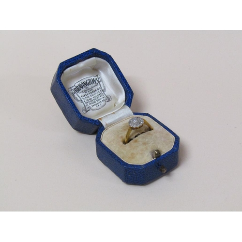 125 - An 18ct gold platinum set diamond ring, size M.