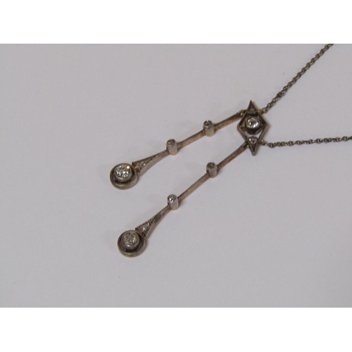 128 - A 1940's white metal (probably platinum) diamond set double drop necklace , central lozenge set thre... 