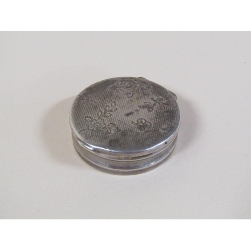 129 - A late 19c Continental silver pill box of circular form with an engine turned floral incised hinged ... 