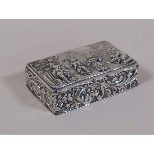 132 - A late Victorian silver table snuff box with hinge cover, embossed and chased throughout with figure... 