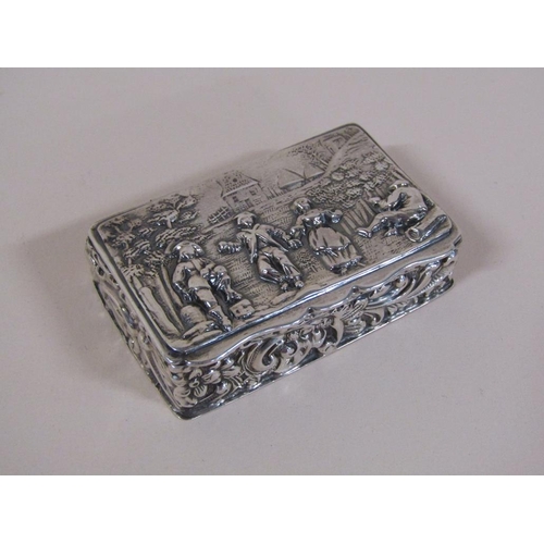 132 - A late Victorian silver table snuff box with hinge cover, embossed and chased throughout with figure... 