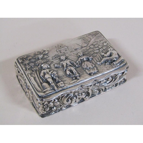 132 - A late Victorian silver table snuff box with hinge cover, embossed and chased throughout with figure... 