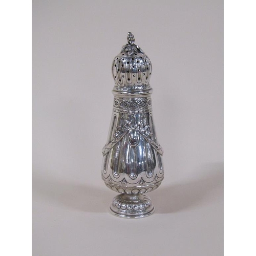 140 - A 19c French silver sugar caster with a pierced dome cover, fruit finial and swags to the baluster b... 