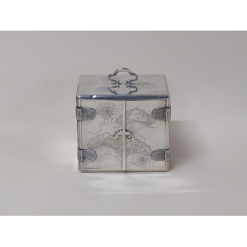 142 - A Japanese silver jewel box of Meiji period with three ebonised drawers and interior panelled doors,... 