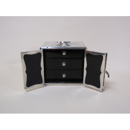 142 - A Japanese silver jewel box of Meiji period with three ebonised drawers and interior panelled doors,... 