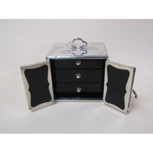 142 - A Japanese silver jewel box of Meiji period with three ebonised drawers and interior panelled doors,... 