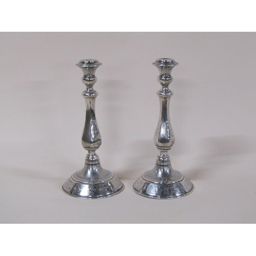 143 - A pair of late 19c Continental silver candlesticks, 16.5ozt, 31cm h.